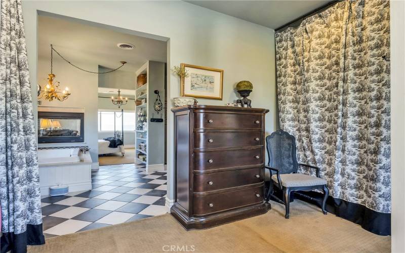 Looking from dressing area back through bathroom and into bedroom.