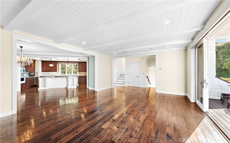 Wood flooring throughout living room, stairwells and bedrooms