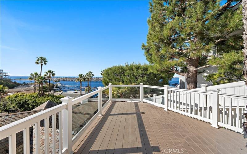 Enjoy the view of the Bay from the deck at the top of the property.