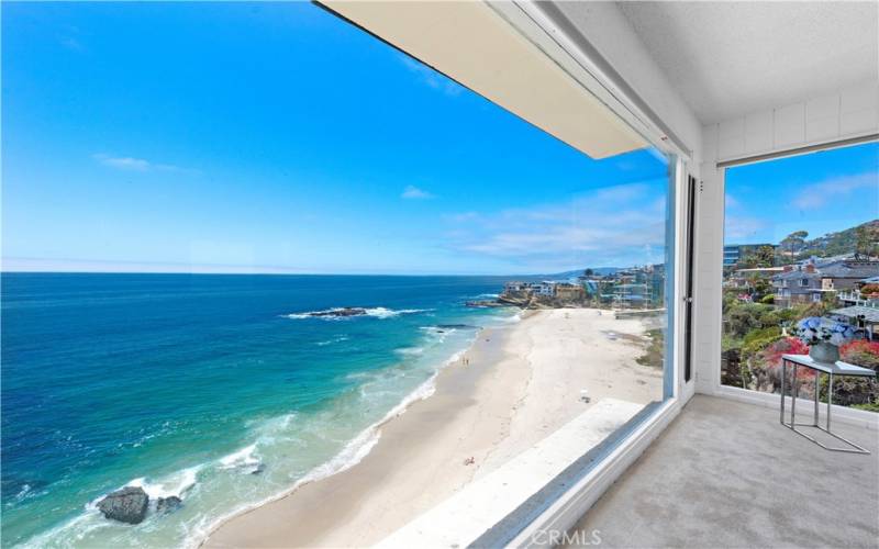 Live above this expansive sandy beach and enjoy 180-degree, unobstructed, ocean views.