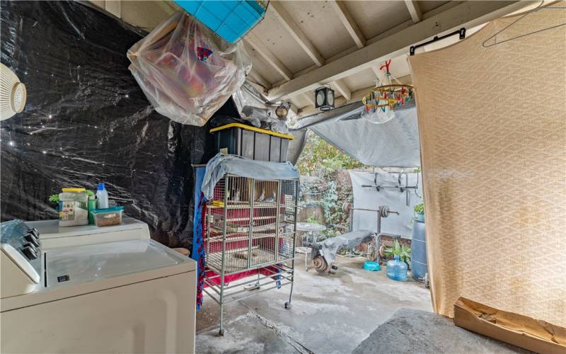 Backyard with laundry area.