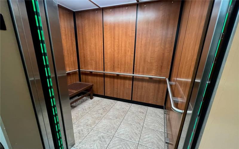 The spacious elevator has plenty of room for you and your grocery cart.