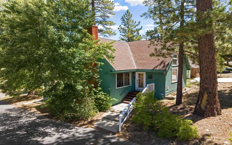 front of home surrounded by beautiful trees