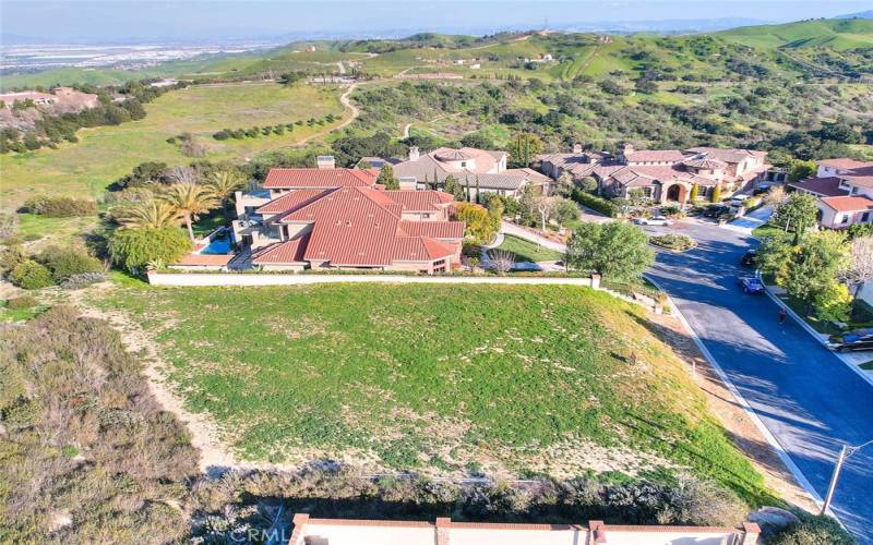 Drone shot view of 2244 Celano Ct. The home in center of photo is 7600 sqft and recently sold for $3,950,000.