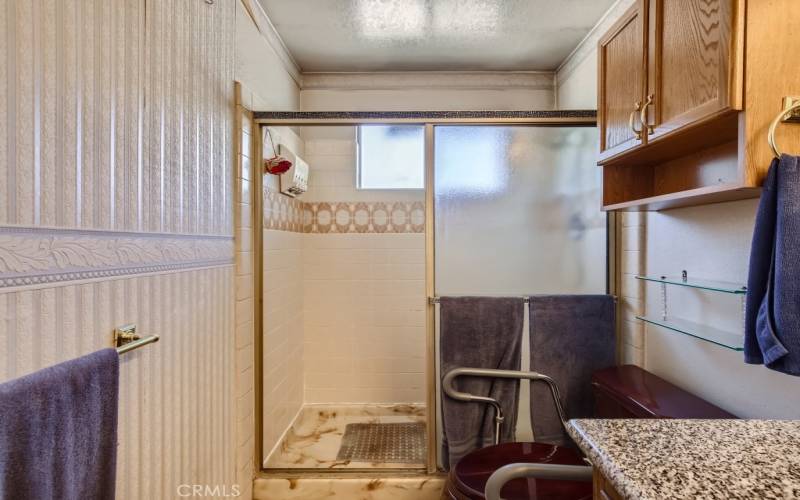 Easily accessible walk-in shower stall.