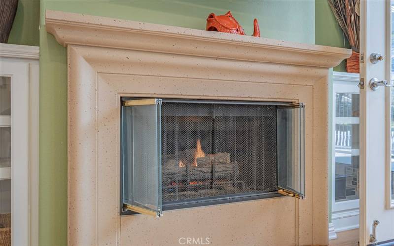 Gas fireplace turns on by the flick of a knob swith! White built in cupboards on either sides of fireplace to compliment the same kitchen cuboards for more addition storage.
