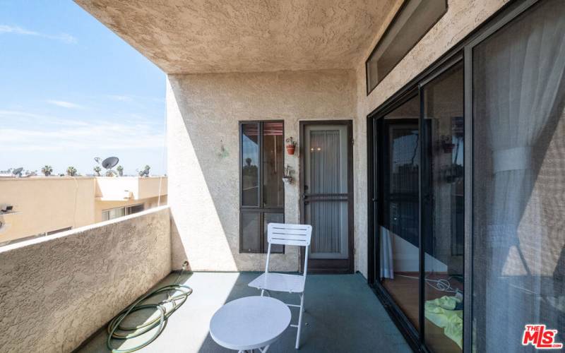 Private outdoor space with southern view from this Top Floor condominium!