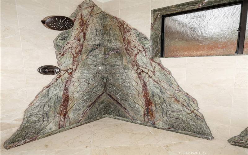 Beautiful granite in downstairs shower and 1 of 2 showerheads