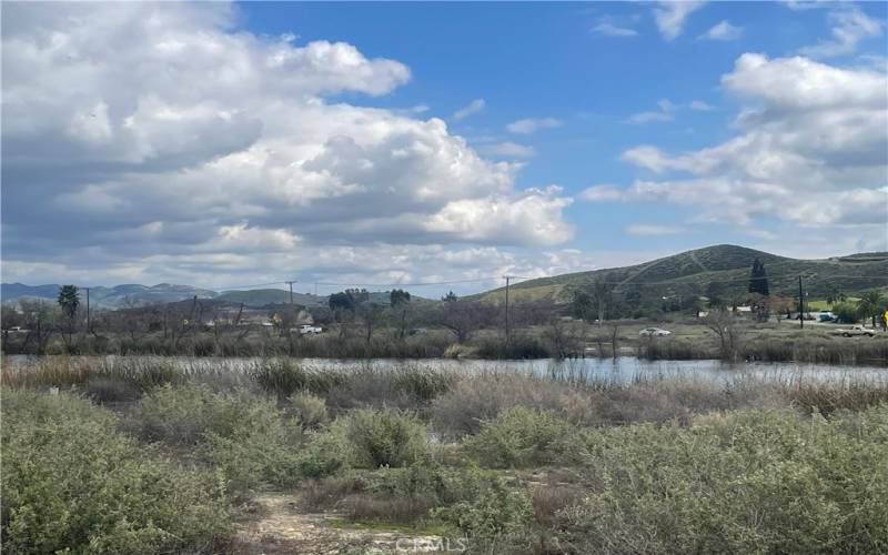 VIEW OF LAKE AND AREA AROUND LOT