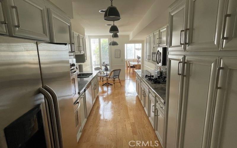 Upgraded kitchen with stainless steel appliances that come with unit.