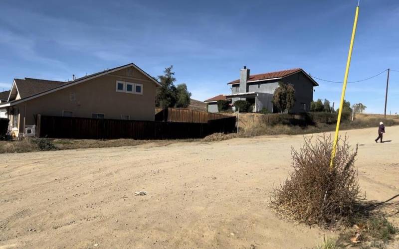 Vacant lot fronting the big house located at the top.