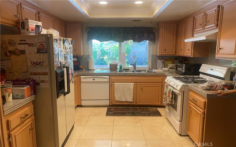 Kitchen with granite counters and travertine floors