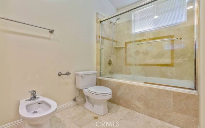 Photo of a similar unit in the complex and not of the subject property. Primary bathroom.