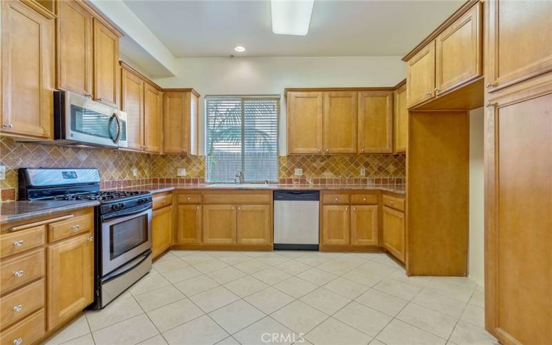 Photo of a similar unit in the complex and not of the subject property. Granite kitchen.