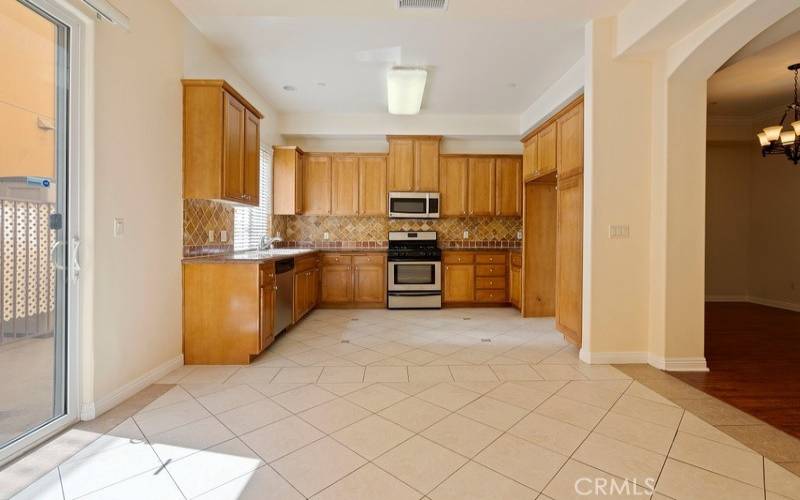 photo of a similar unit in the complex and not of the subject property. Spacious kitchen with breakfast area and side patio.