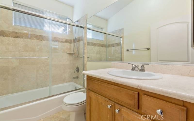 Photo of a similar unit in the complex and not of the subject property. Hallway bath.