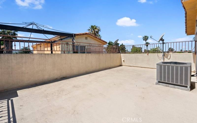 Photo of a similar unit in the complex and not of the subject property. Roof-top patio.