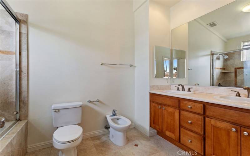 Photo of a similar unit in the complex and not of the subject property. Primary bathroom.