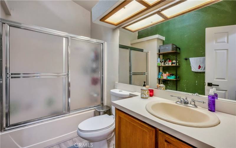 Hall bath with shower over tub.