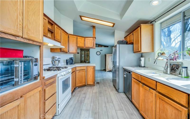 Nicely appointed kitchen with propane range, dishwasher and lots of cabinets.