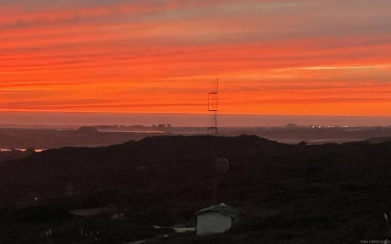 A gorgeous paprika-red sunset w/o any fires! Elkhorn Slough lies in the middle of the crescent shaped Monterey Bay near Moss Landing Harbor. With counts exceeding 100 animals it has the highest concentration of southern sea otters on the California coast.