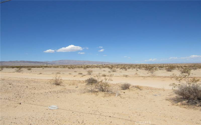 Looking southwest from the land parcel. Nevada Tr.l passing through the picture towards Amboy Rd.