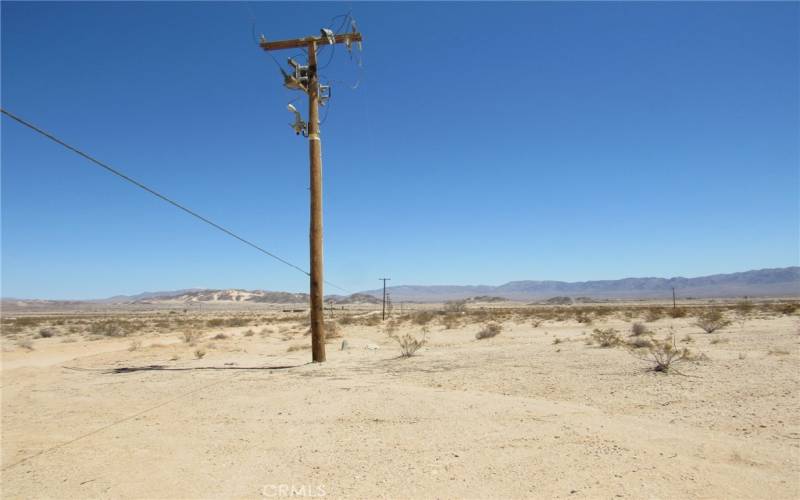 Poles down Nevada Trl. towards the north. A pole just to the northwest corner of the property.