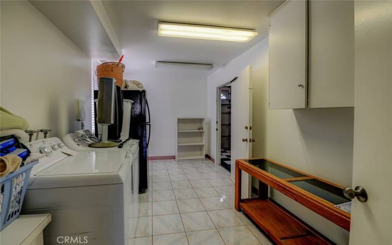 Utility room for washer/dryer and extra fridge.