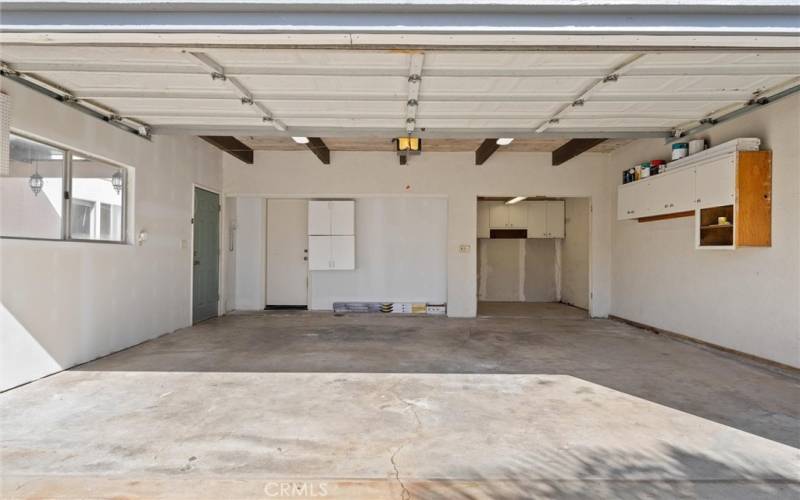 Unit #20-Oversized garage with golf cart parking or additional storage room.