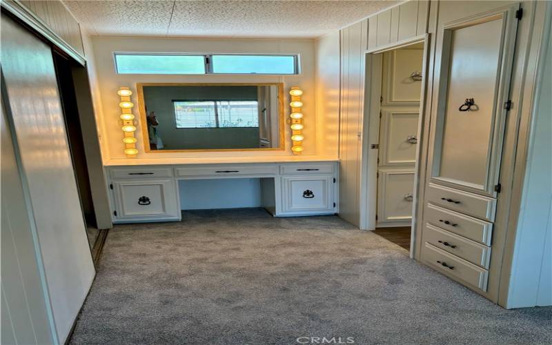 Primary bedroom vanity and closet area