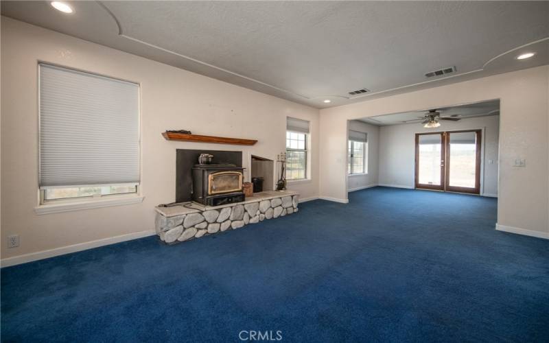 Living room with fireplace and wood storage