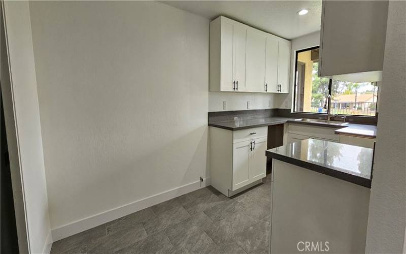 ample space for additional cabinets or breakfest nook if desired