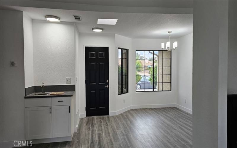 entry wet bar and dining room area