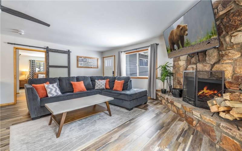 Living room. Updated 100% waterproof vinyl flooring throughout entire home!