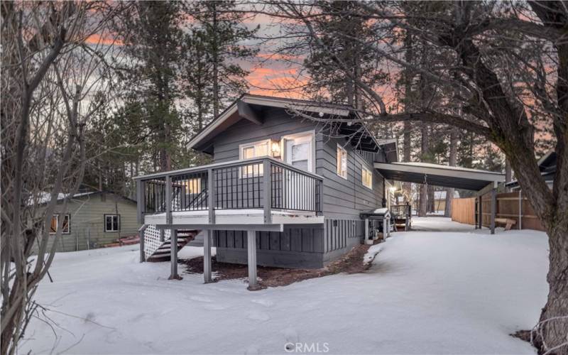 Rear of home with deck to the laundry/mud room.