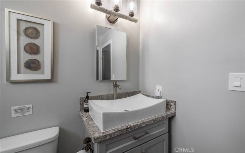 Updated vanity and tiled shower.