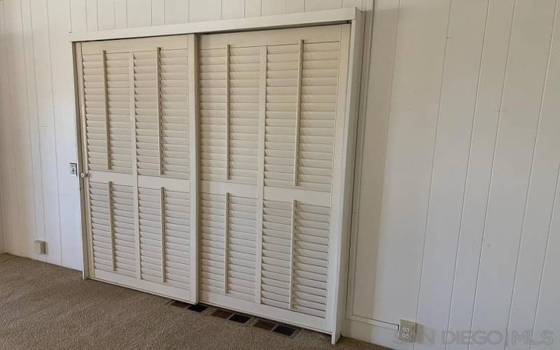 Louvered Door covering entry to Sun Room