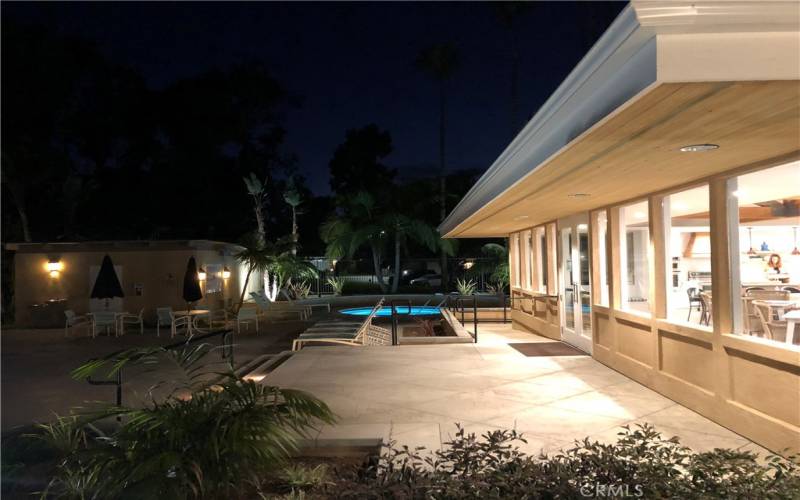 Main pool and clubhouse at night.