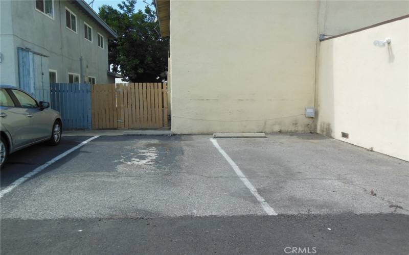 Two outside parking spaces next to two car garages.