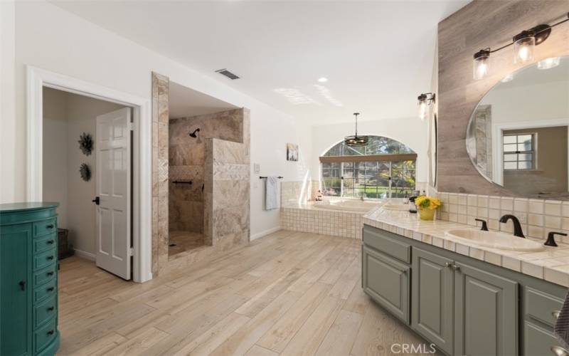 Luxury primary bath with dual sinks, huge walk-in shower & jetted spa tub