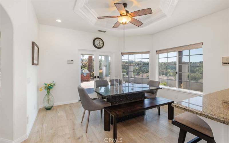 spacious kitchen dining area with direct access to pool and outdoor kitchen