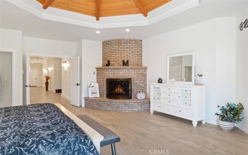 Brick fireplace in primary suite