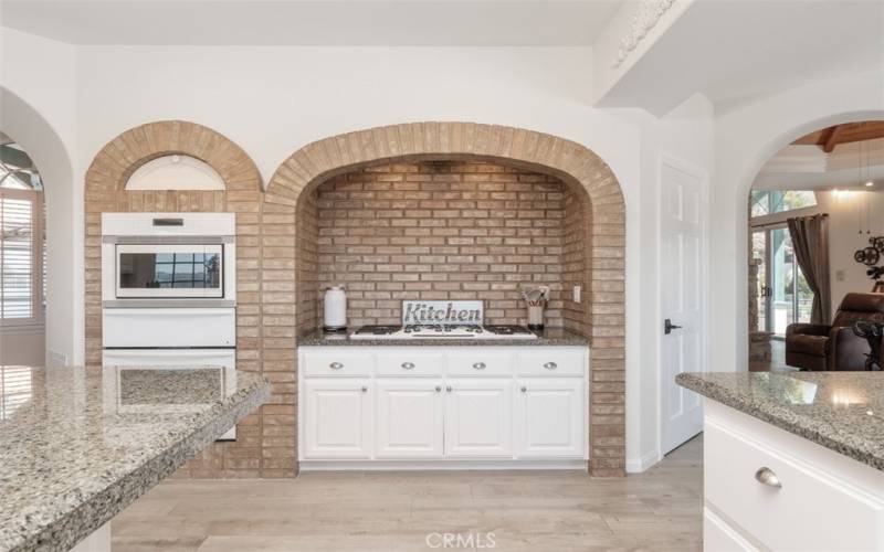 Classic brick & arch above cooktop, oven, microwave & warming drawer