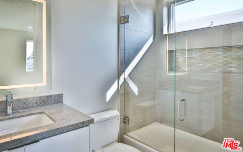 Upstairs bedroom ensuite bath (shower/tub combo)