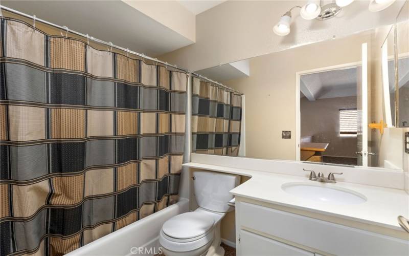 Guest bathroom with shower - tub combo
