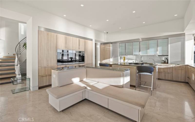 Modern kitchen with built in appliances and settee