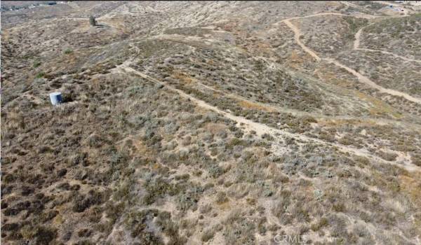 water tank, well and mountain top graded pad area