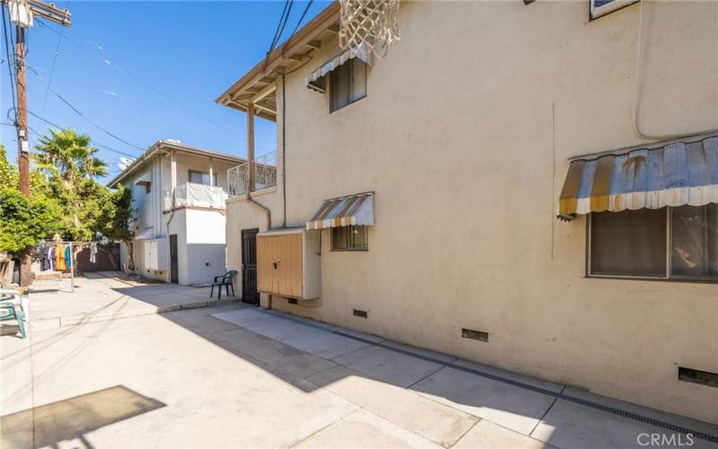 Rear View of 6107 Tujunga Avenue - Well Maintained Building with Low-Maintenance Grounds; Door to Laundry Room