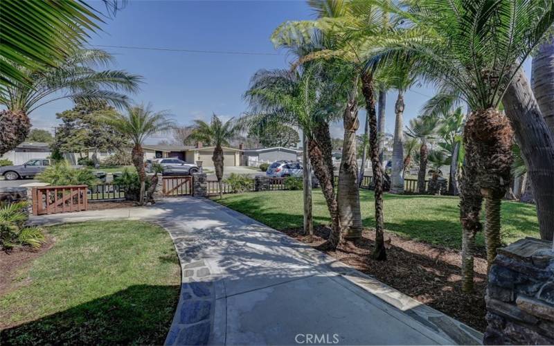 Fully fenced tropically landscaped front yard. Perfect for kids or animals.
