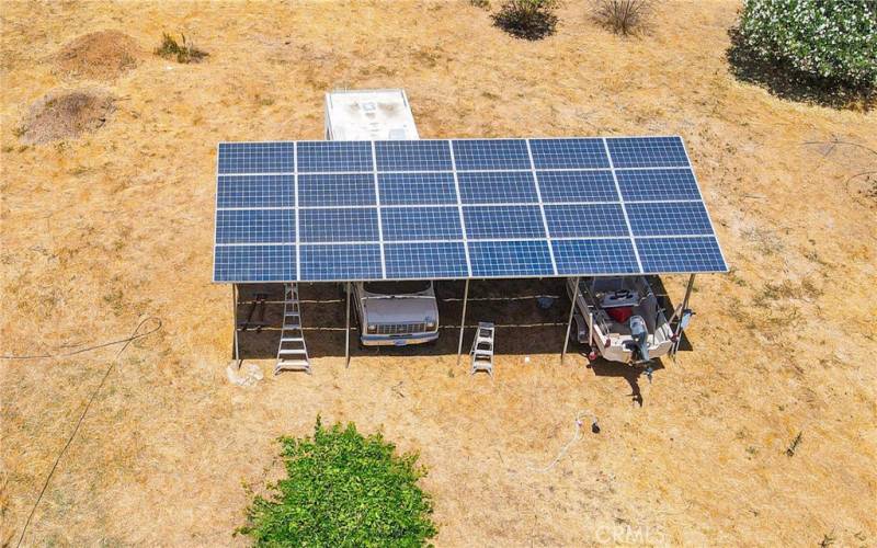 Owner fully, Solar Barn, allows parking under them.